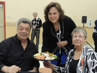 Michelle Graham serves Rick and Bev Cecchini