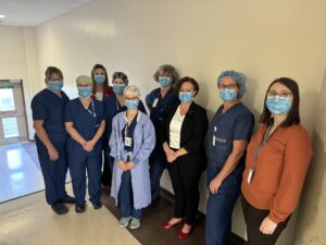 A group of nurses gather at Kemptville hospital to speak with a federal official